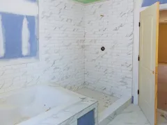 Bathroom remodeling services in Los Angeles featuring shower tile installation, bathtub upgrade, and modern bathroom renovation