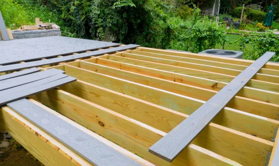 Outdoor living remodeling in Los Angeles with backyard deck construction and wood framing installation