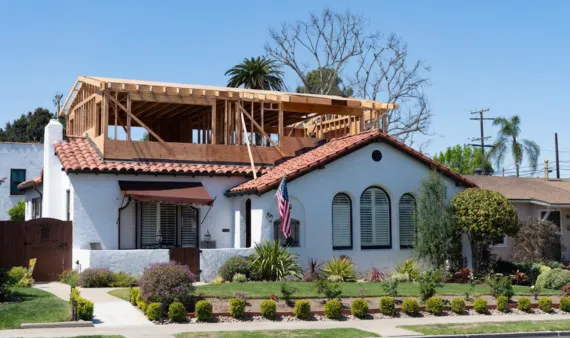 Room addition in Los Angeles showing home expansion with wood framing for second level construction