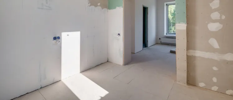 Interior remodeling services in Los Angeles showing drywall installation and open space renovation